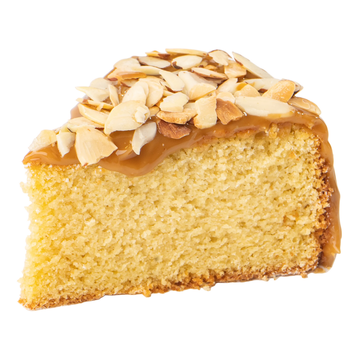 A slice of Lemons Lush or Vanilla Bliss or Florida Orange Cake,  from Full Life Gourmet Bakery cake topped with caramel topping and toasted sliced almonds, isolated on a white background.