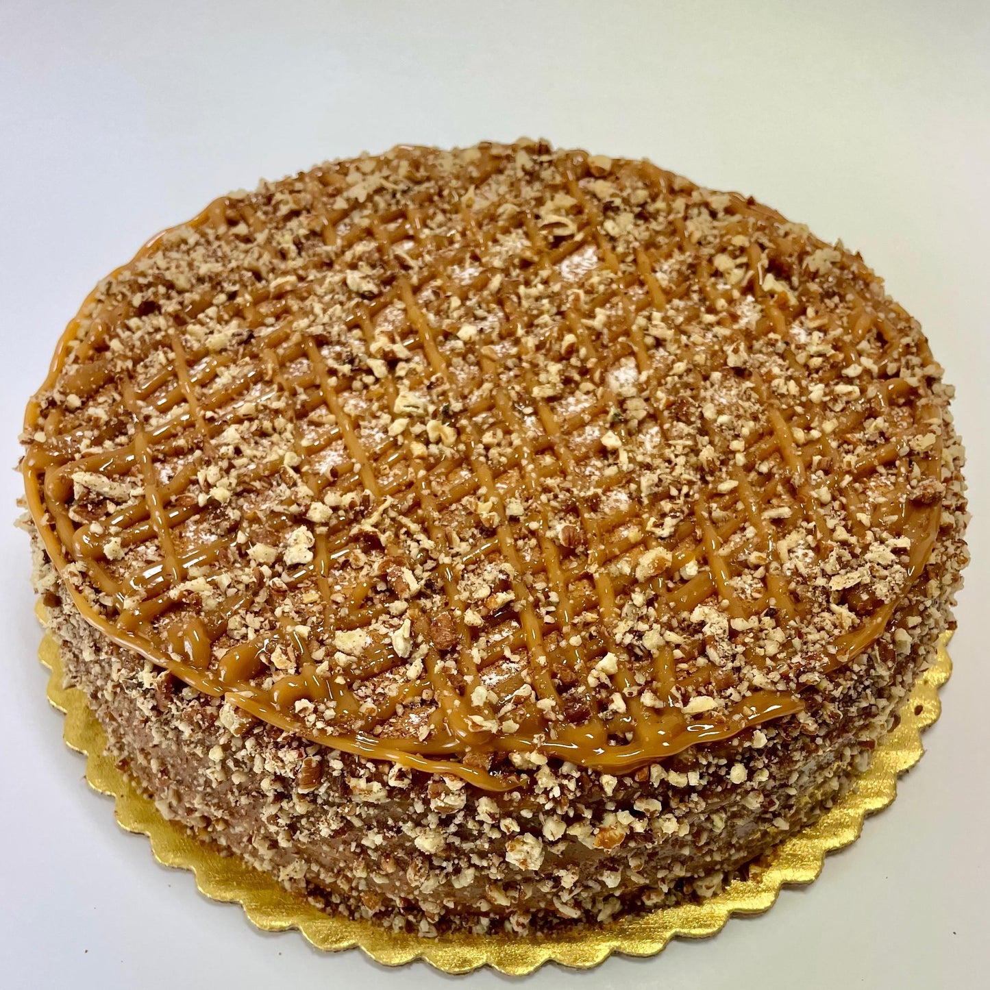 
                  
                    Gluten-free, sugar-free, dairy-free Banana Walnut Full Life Cake with caramel drizzle and crunchy walnuts, emphasizing its moist texture and rich banana flavor. Full Life Gourmet Bakery
                  
                