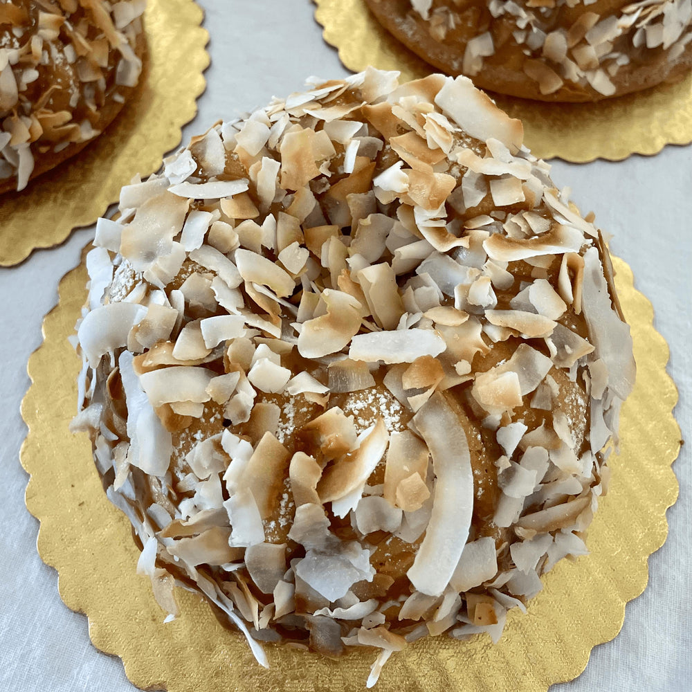 
                  
                    Moist Breeze Coconut cake, gluten, sugar and dairy-free topped in caramel syrup with toasted flakes, a tropical delight. Full Life Gourmet Bakery
                  
                