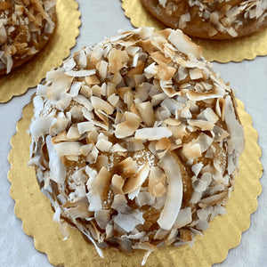 Moist Breeze Coconut cake, gluten, sugar and dairy-free topped in caramel syrup with toasted flakes, a tropical delight. Full Life Gourmet Bakery