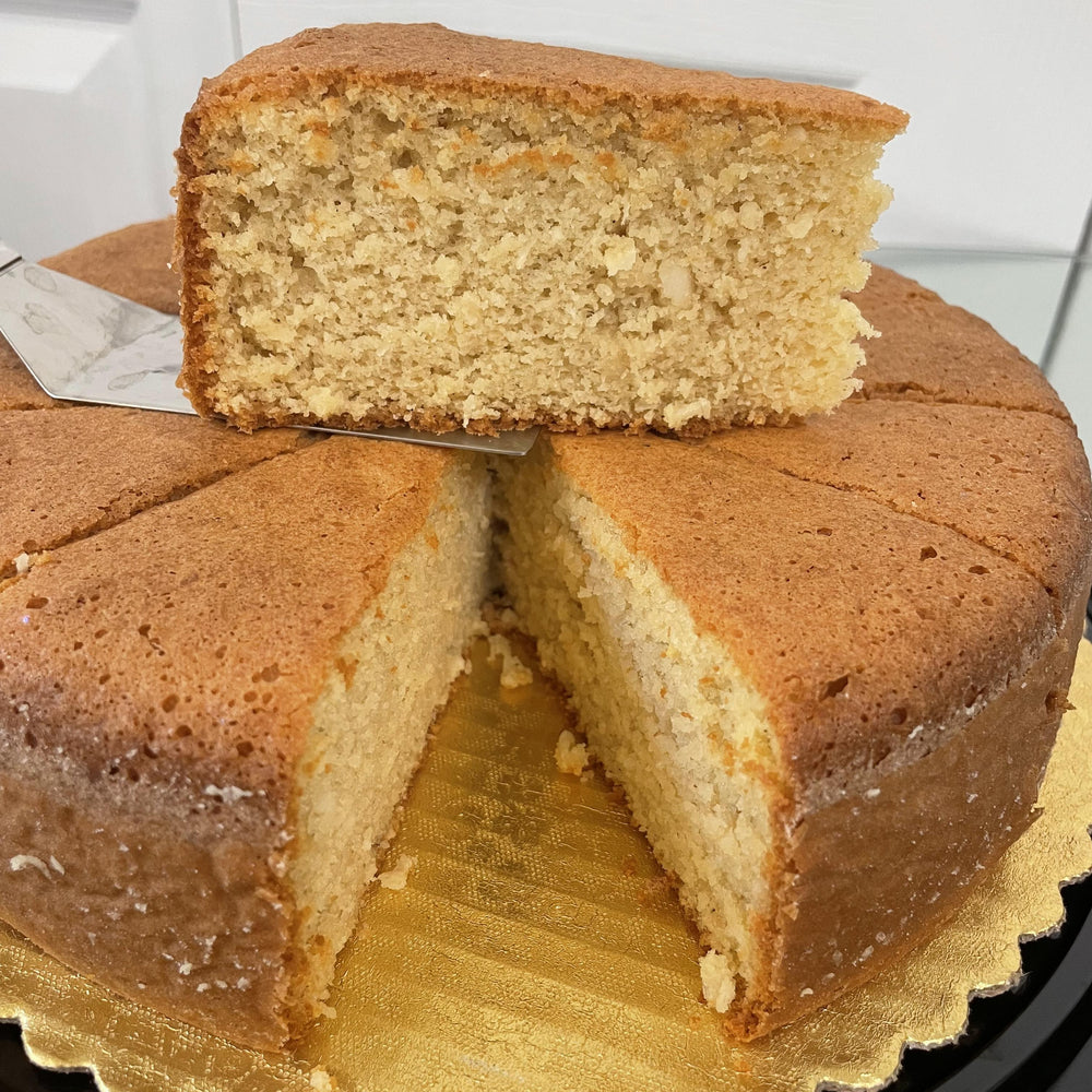 
                  
                    Gluten-free, sugar-free, dairy-free Coconut Full Life Cake topped with sugar-free caramel syrup and golden brown toasted coconut flakes, offering a taste of tropical indulgence.Full Life Gourmet Bakery
                  
                