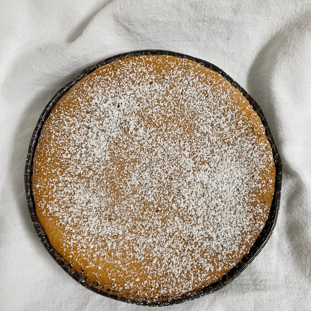 
                  
                    Gluten-free, dairy-free, sugar-free Lemon Lush Cake topped with sugar-free caramel syrup and toasted almonds, highlighting its fluffy texture and zesty lemon flavor. Full Life Gourmet Bakery
                  
                