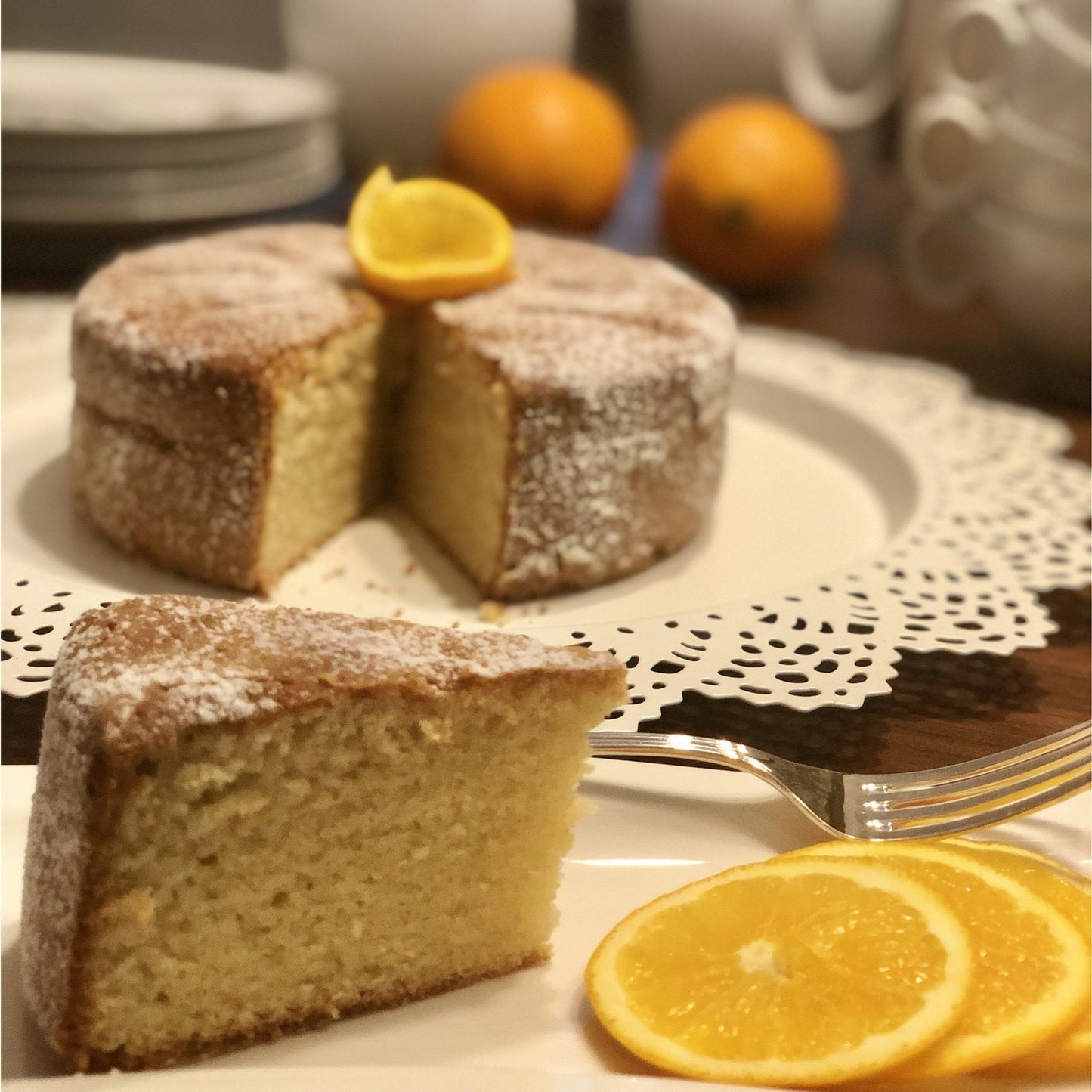 Tangy Florida Orange cake with caramel waterfall and toasted almond topping, a citrusy, sugar, dairy and gluten-free treat. Full Life Gourmet Bakery