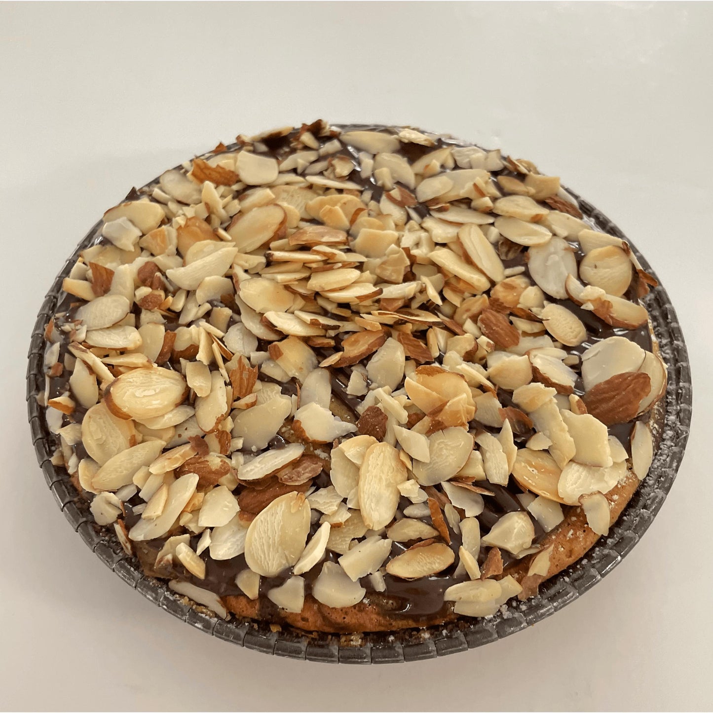 
                  
                    Gluten-free, dairy-free, sugar-free Vanilla Caramel Full Life Cake with a sugar-free caramel syrup drizzle and toasted almonds, showcasing its spongy texture and rich vanilla aroma. Full Life Gourmet Bakery
                  
                